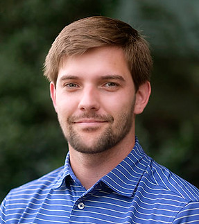 Aaron Murray headshot with a striped polo